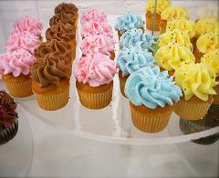 cupcakes with yellow, brown, pink and blue frosting