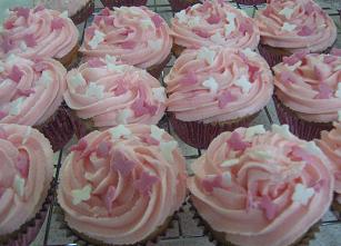 cupcakes with pink buttercream frosting and butterflies